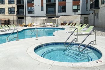 Circular spa hot tub near then outdoor resort style pool  at Haven at Uptown.