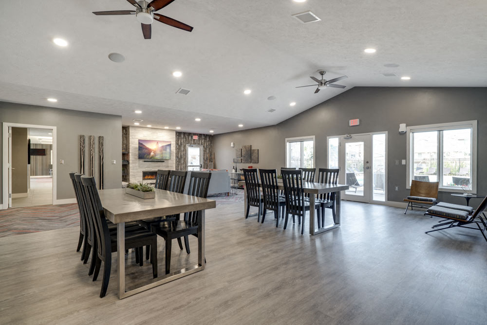Clubhouse interior with tables and seating at Highland View Apartments in north Lincoln NE 68521