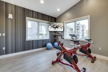 Yoga/spin studio with TV at Highland View Apartments in north Lincoln NE 68521 - Photo Gallery 7