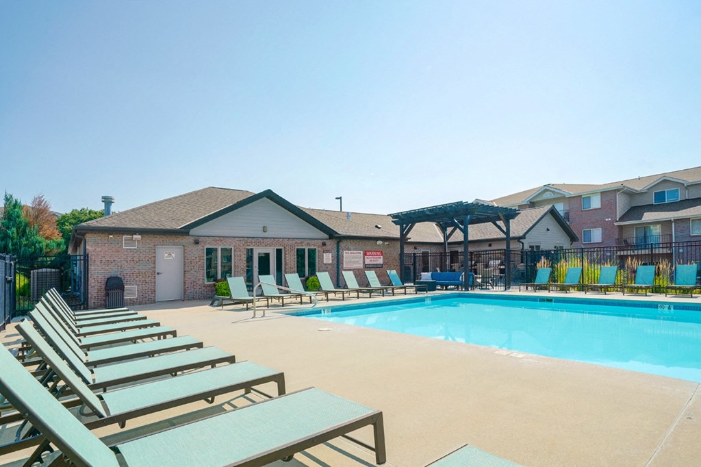 Highland View's pool deck and clubhouse the back of the Highland View Apartments clubhouse that leads to the pool deck