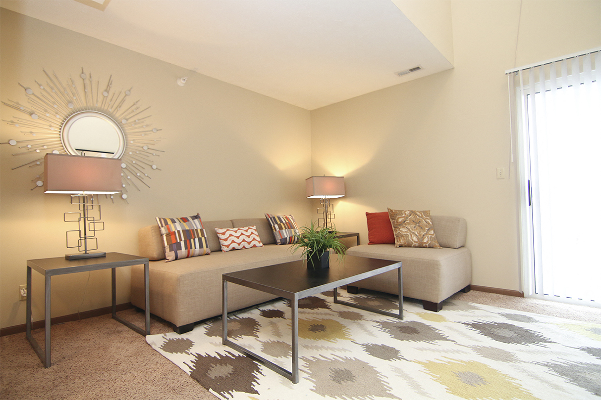 Bright natural lighting in living space at Pine Lake Apartments