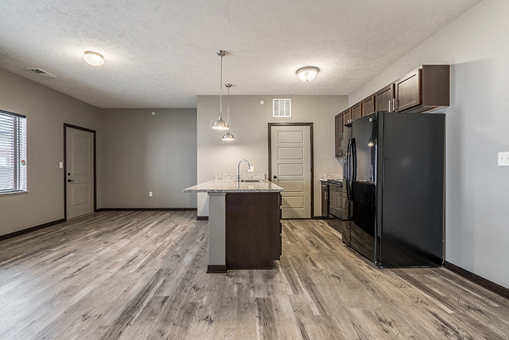 Kitchen with granite countertops and lots of cabinet space at North Pointe Villas