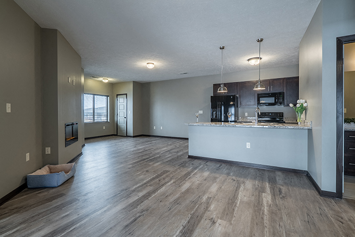view of open floorplan living space and kitchen including island at North Pointe Villas