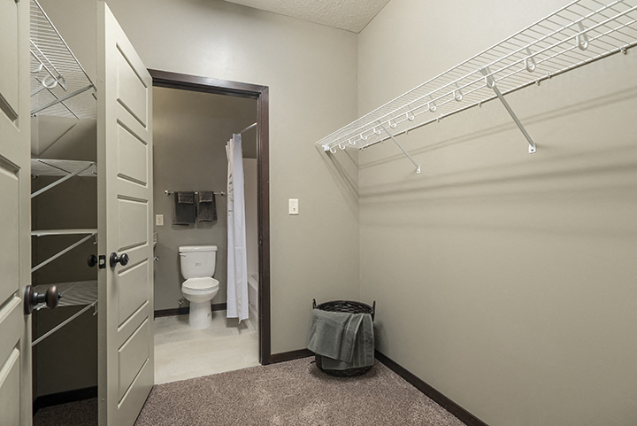 Large walk in closet providing plenty of storage space at North Pointe Villas