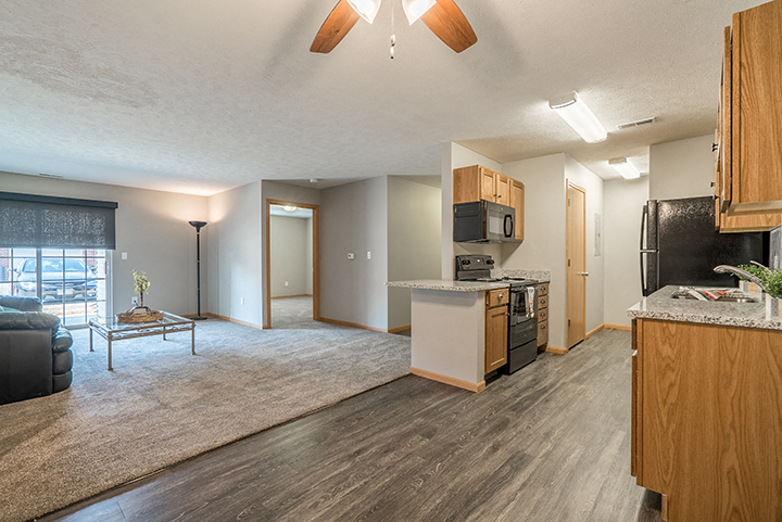 Kitchen with hardwood-style flooring at Williamsburg Park Apartments in Lincoln NE