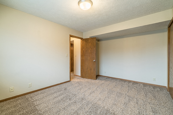 Bedroom with plenty of natural light at Fountain Glen Apartments