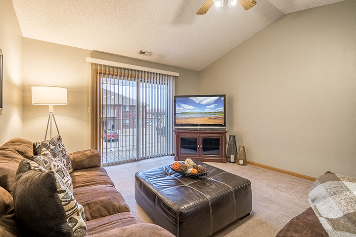 Living space with sliding doors at Fountain Glen Apartments
