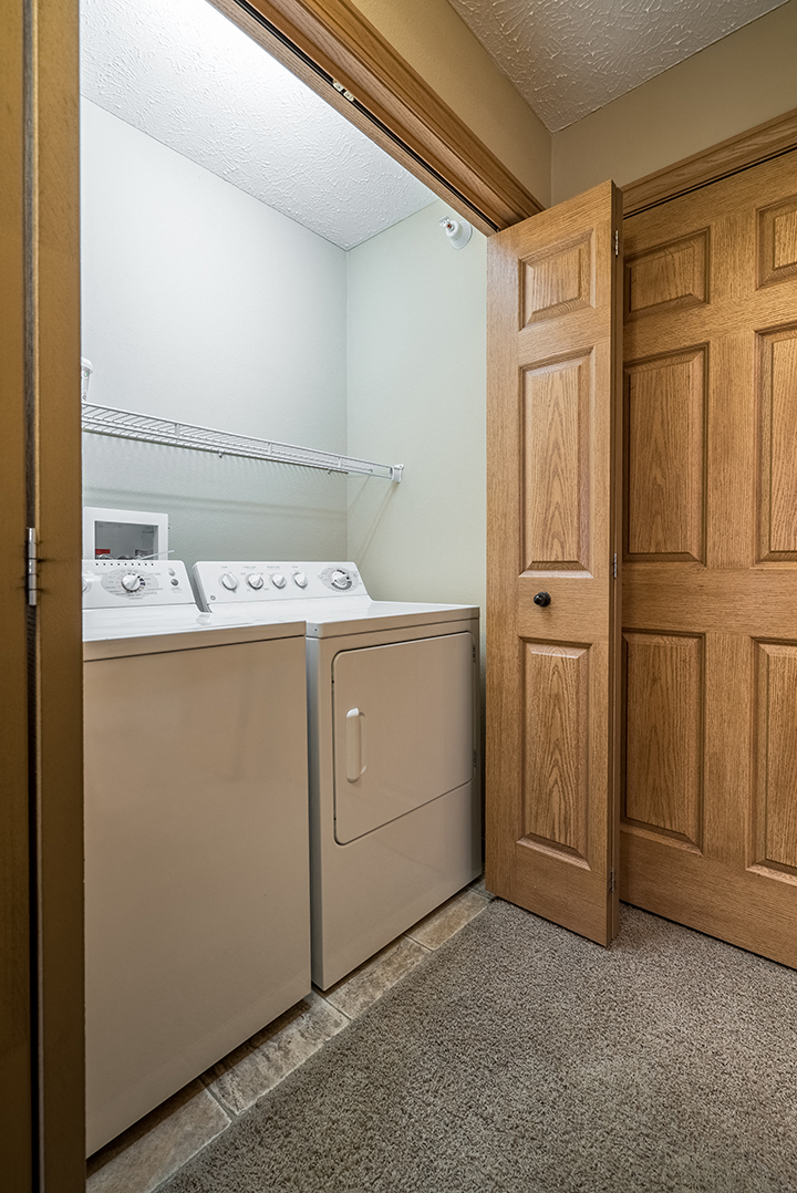 Full sized washer and dryer available in unit at Grand Legacy Apartments