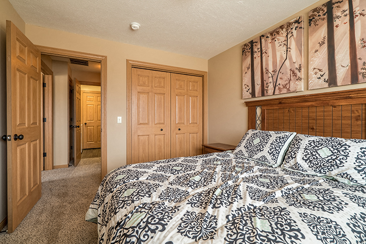 Large bedroom with lots of natural lighting at Grand Legacy Apartments