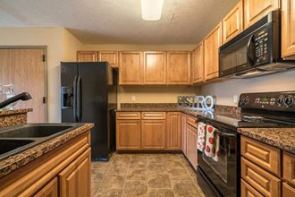 Large open concept kitchen with updated appliances at Grand Legacy Apartments