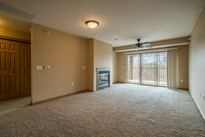 Large living space brightly lit from plenty of natural lighting at Grand Legacy Apartments