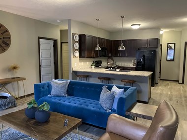 Kitchen and living room in a Harper three bedroom apartment at North Point Villas in Lincoln Ne