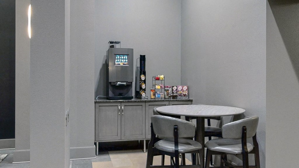 Grab a complimentary cup of coffee in the comfortable and modern lobby at Midtown Crossing Apartments