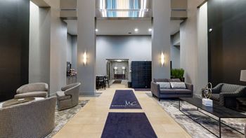 Lobby at Midtown Crossing Apartments in Omaha Nebraska featuring plenty of seating and a coffee station