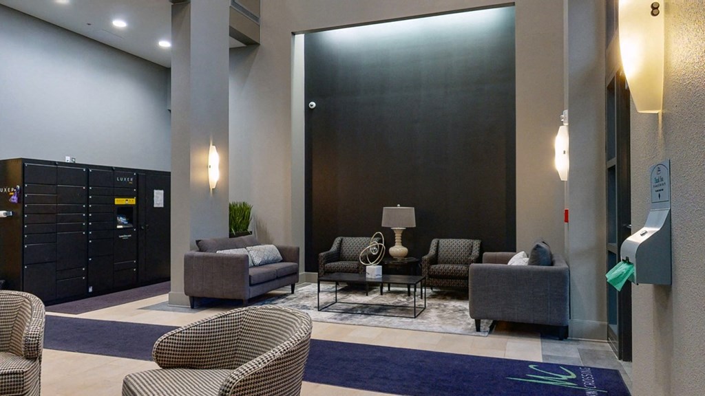 Sit back and relax in the modern lobby at Midtown Crossing Apartments in Omaha.