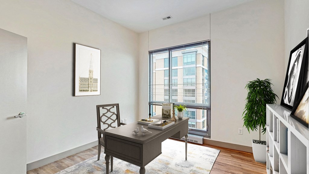Bright and spacious bedroom that could be used as home office with floor-to-ceiling windows a 2 bedroom penthouse floor plan Midtown Crossing Apartments Omaha