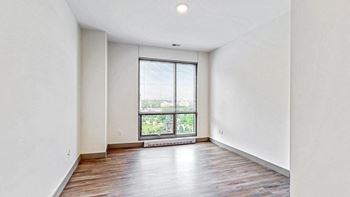 Spacious bedroom with floor-to-ceiling windows a 2 bedroom penthouse floor plan Midtown Crossing Apartments Omaha