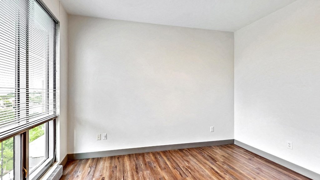 Spacious bedroom with floor-to-ceiling windows a 2 bedroom penthouse floor plan Midtown Crossing Apartments Omaha