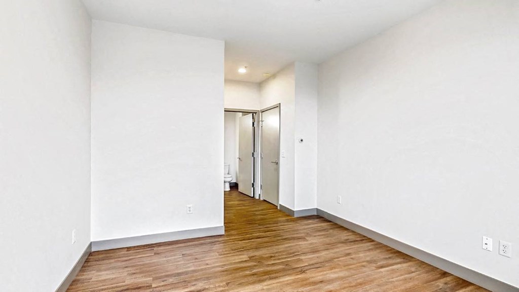 Spacious bedroom with floor-to-ceiling windows a 2 bedroom penthouse floor plan Midtown Crossing Apartments Omaha