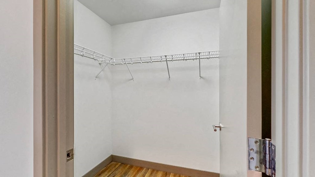 Easy living with plenty of storage space in the walk in closet of a 2 bedroom penthouse floor plan at Midtown Crossing Apartments Omaha