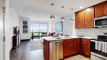 Midtown Crossing Apartments has floor-to-ceiling windows that fill this 1 bedroom apartment with bright natural light.