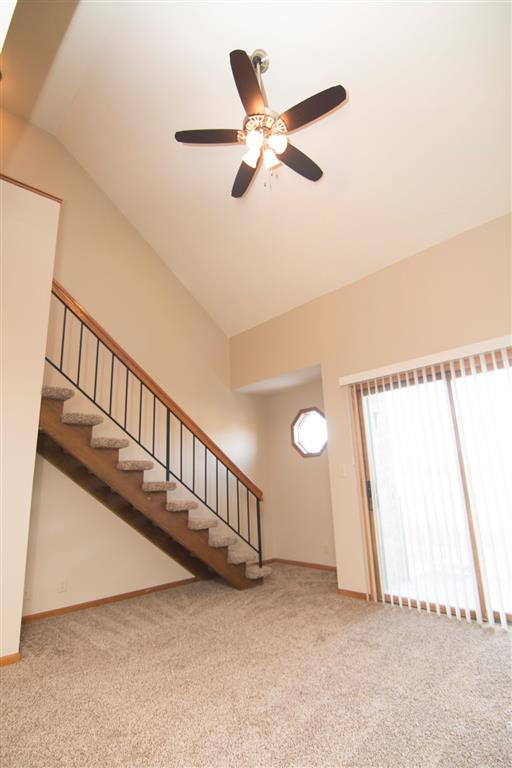 interior and stairs with ceiling fan at Fountain Glen Apartments in Lincoln Nebraska