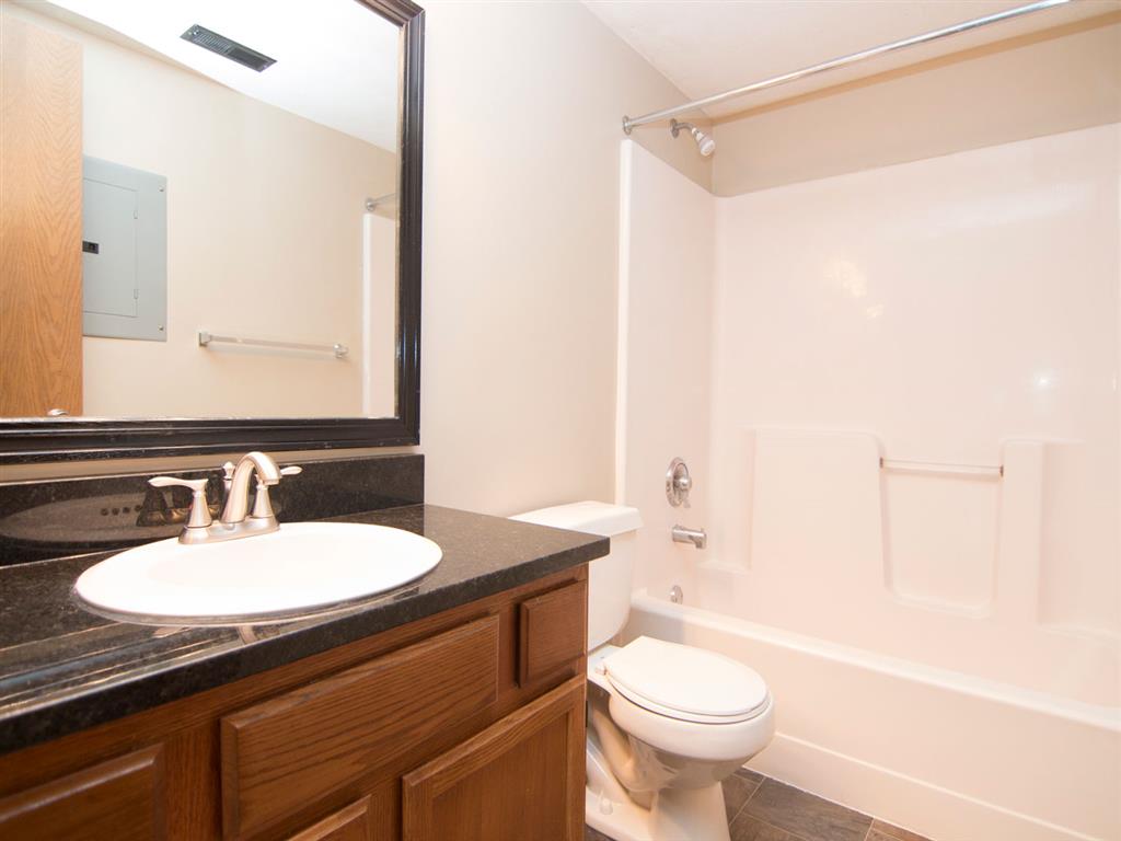Spacious bathroom with bathtub at Fountain Glen Apartments in Lincoln Nebraska