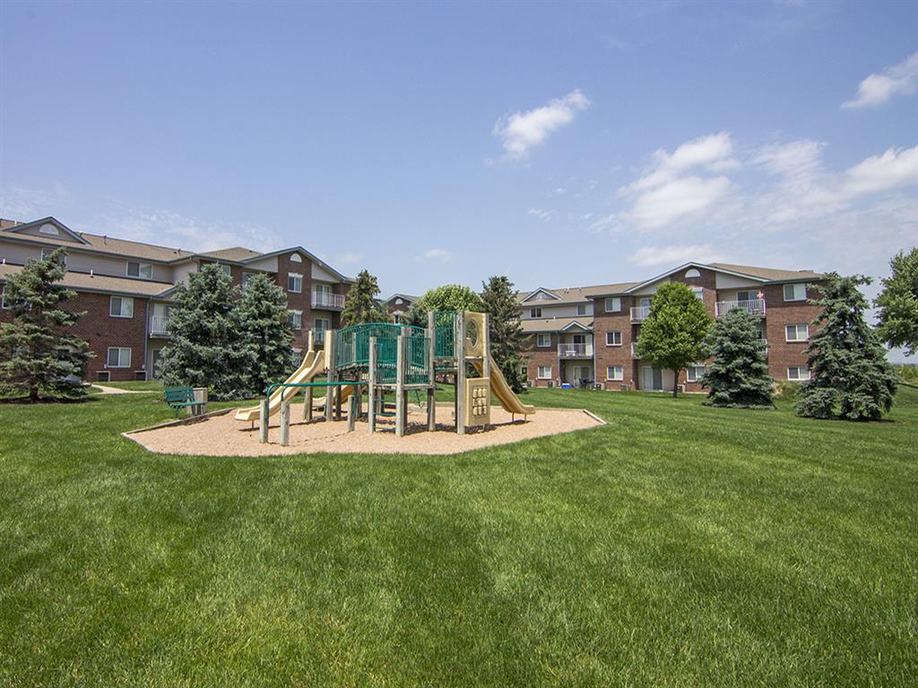 Playground and grass at Northridge Heights apartments in Lincoln