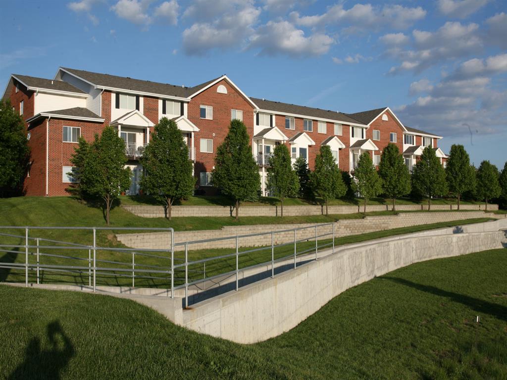 side of exterior and bike path at Pine Lake Heights Apartments in Lincoln Nebraska