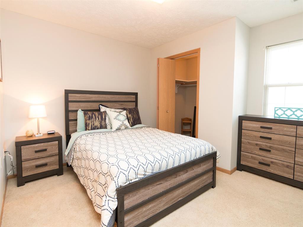 Bedroom with walk-in closet at Eagle Run Apartments in Omaha, NE