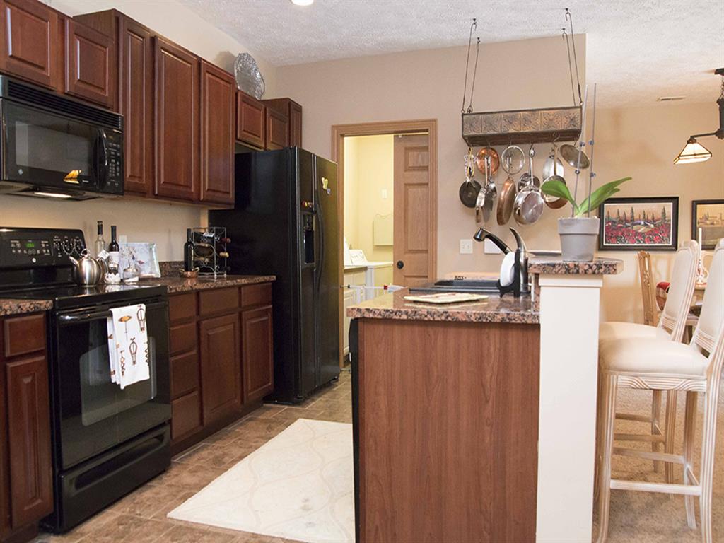 kitchen with counter top seating at Grand Legacy in Omaha Nebraska