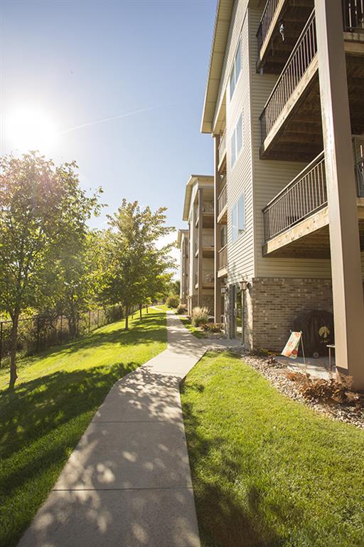 exterior side with walking path at Grand Legacy in Omaha Nebraska