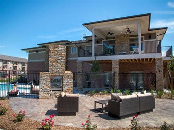 Outdoor fireplace and lounge at Villas of Omaha at Butler Ridge in Omaha NE - Photo Gallery 50