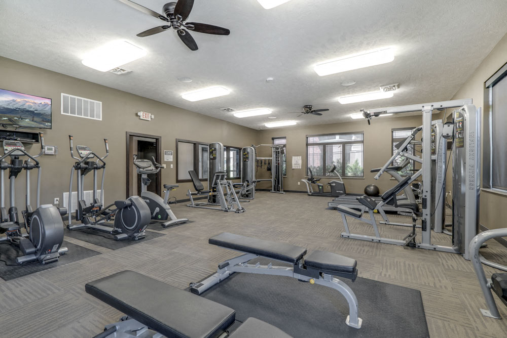 Fitness center with strength and cardio equipment at North Pointe Villas