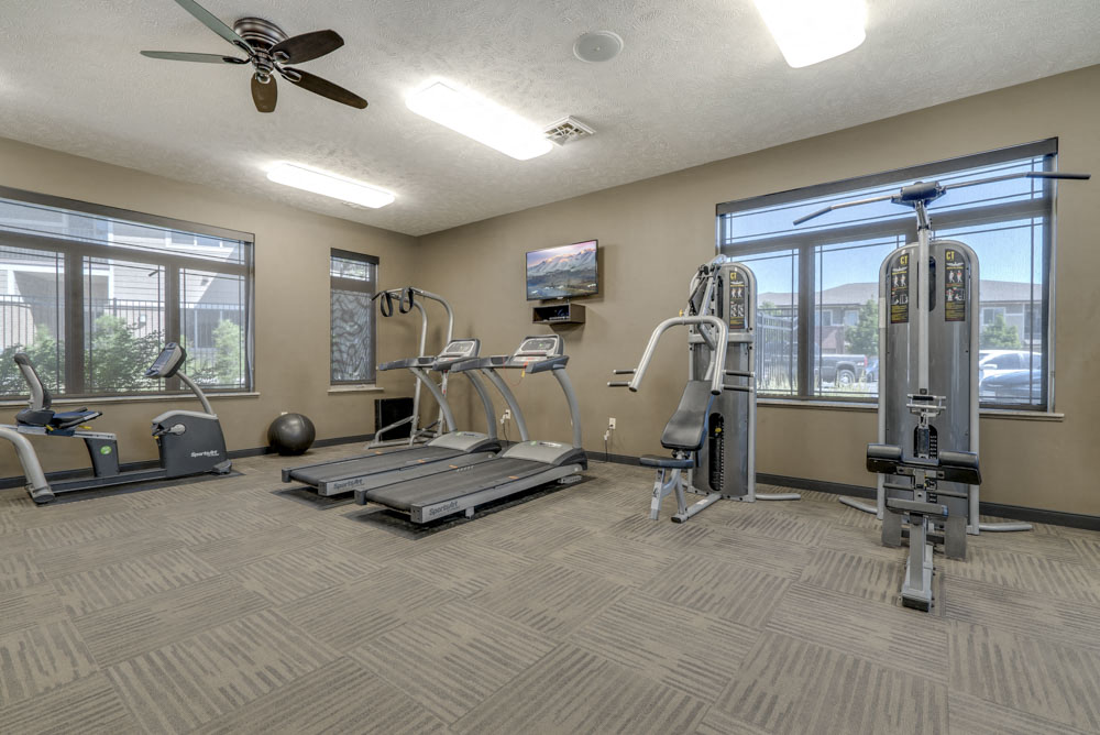 Fitness center with strength and cardio equipment at North Pointe Villas