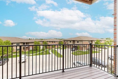A view from the balcony overlooking the community and blue sky.