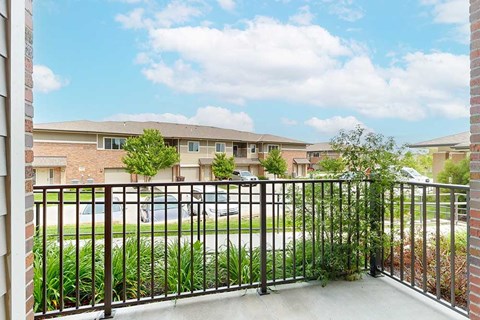 A view from the balcony of the neighboring homes, and the green spaces in the community.