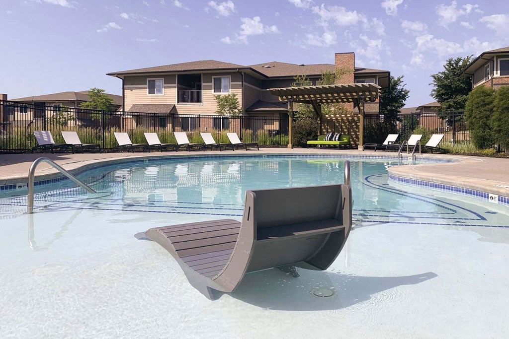 Resort style swimming pool with sun tanning loungers at North Pointe  Villas Lincoln Nebraska