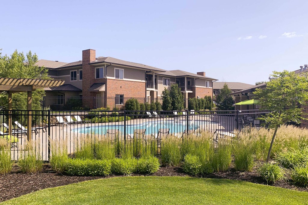 a swimming pool with a building in the background