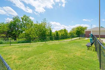 a fenced in dog park with open green space to let your dog off-leash
