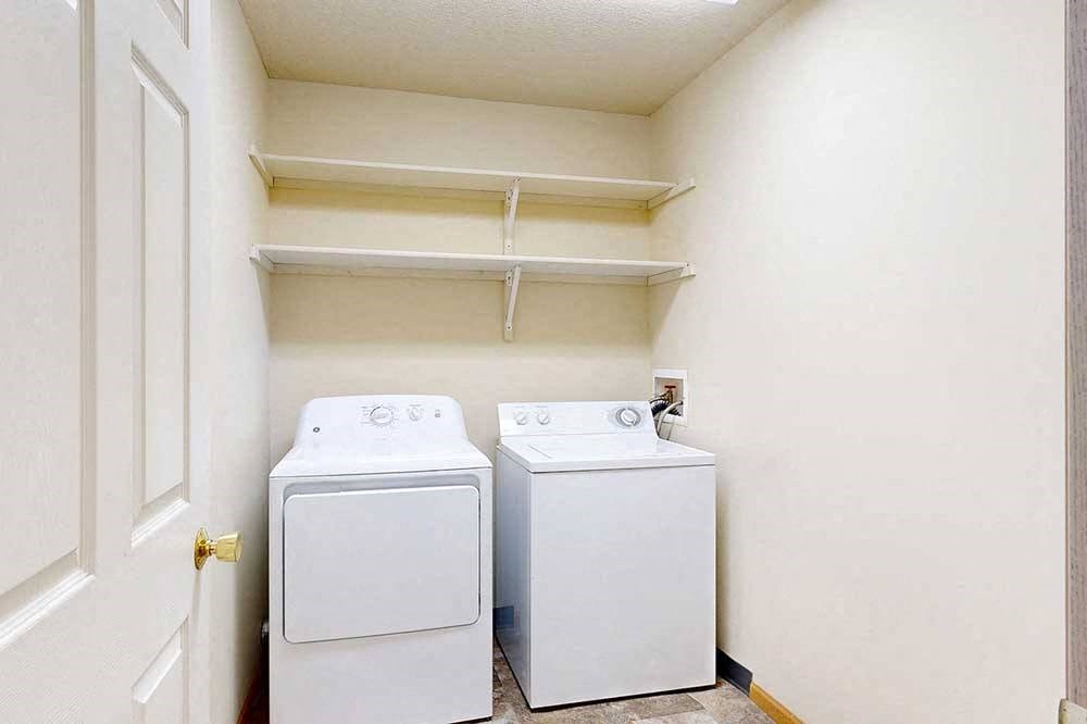 washing machine and dryer in a laundry room