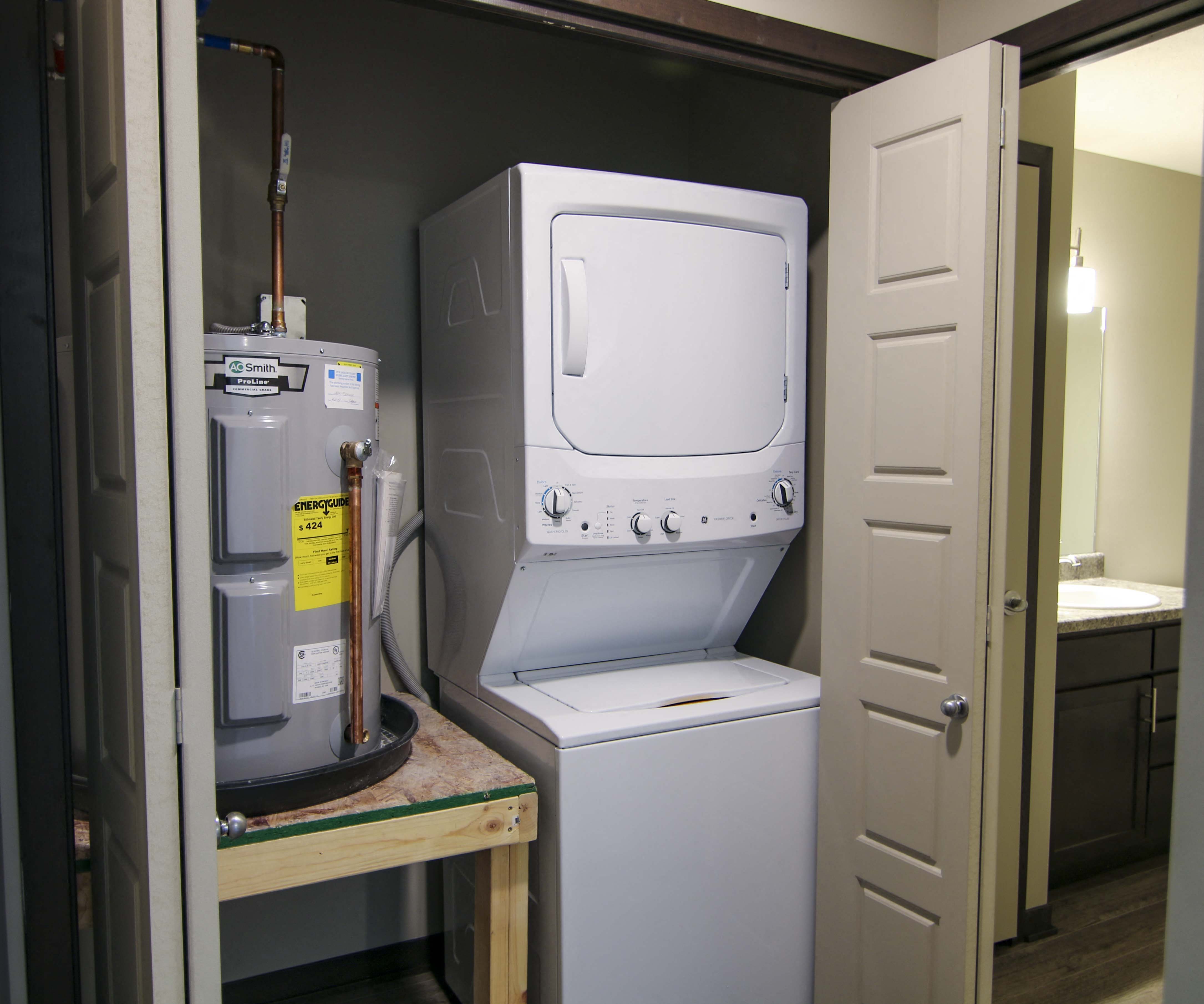 Stacked washer and dryer off bathroom at Northridge Heights in Lincoln