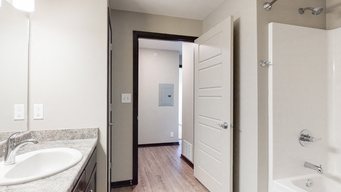 Renovated bathroom with linen storage closet at Northridge Heights Apartments
