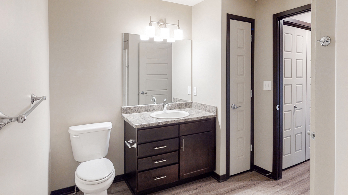 Renovated bathroom with linen storage closet at Northridge Heights Apartments