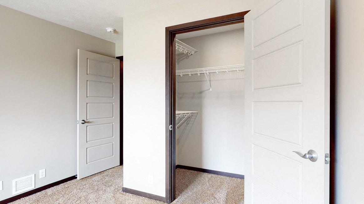 Bedroom with large walk in closet for storage in Northridge Heights apartments in Lincoln