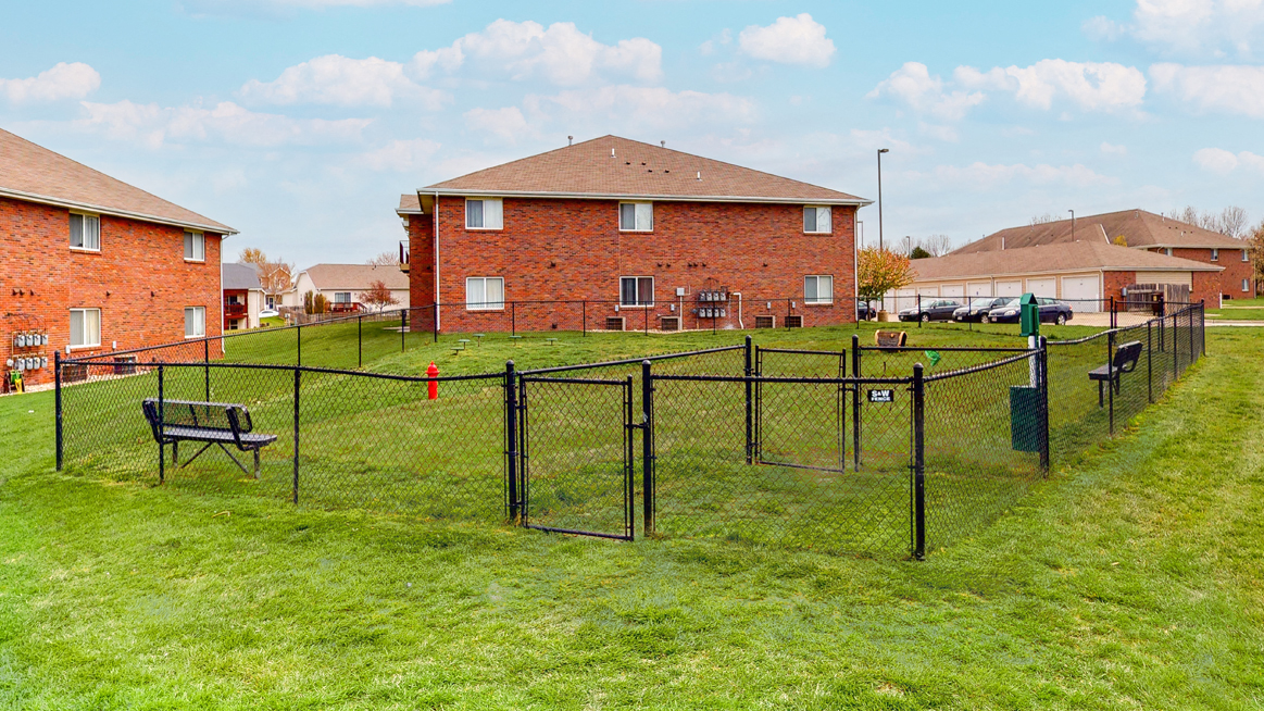 Large fenced dog park with grass at Northridge Heights apartments in Lincoln
