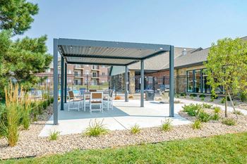 Covered outdoor seating and dining area with modern furniture