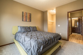 Interiors- Bedroom that easily fits a large bed at The Villas of Omaha at Butler Ridge in Omaha Nebraska - Photo Gallery 67