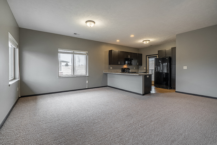 Interiors- Large living space with abundant natural light at the Villas of Omaha at Butler Ridge in Omaha Nebraska