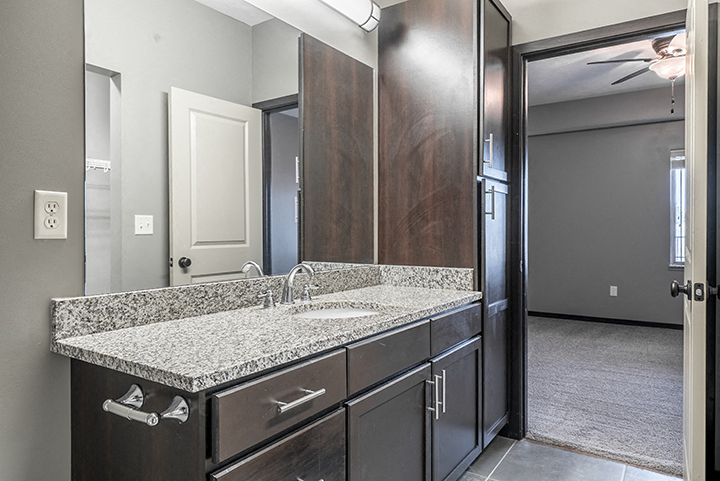 Interiors- Granite countertops vanity in Bathroom at the Villas of Omaha at Butler Ridge in Omaha Nebraska